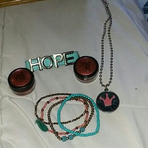 A bundle with two pink eye shadows 5 bracelet one